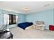Spacious bedroom with a comfortable bed, cozy seating area, and natural light at 8630 Aylesworth Dr, Camby, IN 46113