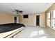 Spacious bedroom featuring neutral walls, carpet, and ceiling fan with an adjoined room at 8630 Aylesworth Dr, Camby, IN 46113