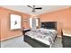 Well-lit bedroom featuring a comfortable bed, ceiling fan, and ample natural light at 8630 Aylesworth Dr, Camby, IN 46113