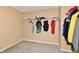 Spacious walk-in closet with carpet, featuring a hanging rack for clothing storage at 8630 Aylesworth Dr, Camby, IN 46113