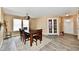 Light-filled dining area showcasing neutral walls and wood flooring at 8630 Aylesworth Dr, Camby, IN 46113