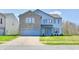 Charming two-story home with a brick facade, attached garage, and well-maintained landscaping at 8630 Aylesworth Dr, Camby, IN 46113