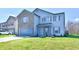 Lovely two-story home with a brick facade, attached garage, and a beautifully landscaped front yard at 8630 Aylesworth Dr, Camby, IN 46113