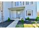 Well-maintained front porch featuring decorative landscaping, a stylish entrance, and charming architectural details at 8630 Aylesworth Dr, Camby, IN 46113