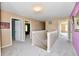 Bright hallway showcasing neutral colors and architectural details leading to various rooms at 8630 Aylesworth Dr, Camby, IN 46113
