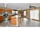 Bright kitchen featuring wood cabinets, a kitchen island with seating, and sliding glass doors to the outside at 8630 Aylesworth Dr, Camby, IN 46113