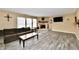 Cozy living room features a fireplace, wood floors, and a comfortable sofa at 8630 Aylesworth Dr, Camby, IN 46113