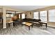 Open floor plan living room with wood floors and views into the dining room and kitchen at 8630 Aylesworth Dr, Camby, IN 46113