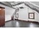 Attic featuring finished hardwood floors and small windows at 914 Chase St, Anderson, IN 46016