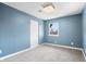 Neutral bedroom featuring natural light, soft gray carpeting, and white door at 914 Chase St, Anderson, IN 46016