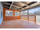Covered deck boasts wood beam ceiling, recessed lighting, and wood spindles at 914 Chase St, Anderson, IN 46016