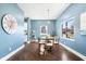 Dining room featuring hardwood floors and a large window at 914 Chase St, Anderson, IN 46016