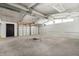 Spacious two-car garage featuring concrete floors and a bright, clean interior at 914 Chase St, Anderson, IN 46016