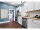 Well-lit kitchen featuring stainless steel appliances and hardwood floors at 914 Chase St, Anderson, IN 46016