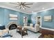 Inviting living room features a unique fireplace and hardwood floors at 914 Chase St, Anderson, IN 46016