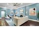 Bright living room featuring a fireplace, hardwood floors, and light blue walls at 914 Chase St, Anderson, IN 46016