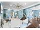 Bright living room featuring a stylish ceiling fan, fireplace, and hardwood floors at 914 Chase St, Anderson, IN 46016