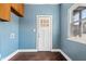 Convenient mud room features updated flooring and a window to the neighborhood at 914 Chase St, Anderson, IN 46016