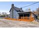 Charming home with new covered deck, picket fence, and fresh exterior paint at 914 Chase St, Anderson, IN 46016