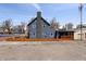 Back of home featuring newly constructed deck, fresh exterior paint, and picket fence at 914 Chase St, Anderson, IN 46016