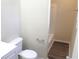 Bathroom featuring sleek laminate flooring, a new toilet, and a bathtub with shower at 9238 Celtic Ct, Indianapolis, IN 46235