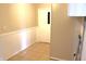 Spacious hallway with tile floors and painted trim, offering functional layout at 9238 Celtic Ct, Indianapolis, IN 46235