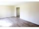 Bright and spacious living room features new laminate flooring with a neutral color palatte for versatile decorating at 9238 Celtic Ct, Indianapolis, IN 46235