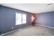 Cozy bedroom featuring carpet flooring and a window for natural light at 93 Walnut St, Indianapolis, IN 46227