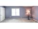 Bedroom with carpet flooring and a lamp in the corner next to a window at 93 Walnut St, Indianapolis, IN 46227