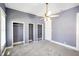 A well lit bedroom featuring multiple closets and a ceiling fan at 93 Walnut St, Indianapolis, IN 46227