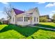 Angle view showing a quaint house with nice yard and a cozy porch area, ideal for a starter home at 93 Walnut St, Indianapolis, IN 46227