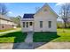 Charming cottage-style home with a well-maintained lawn, awning details, and inviting curb appeal at 93 Walnut St, Indianapolis, IN 46227