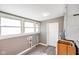 Utility room with bright light, vinyl flooring, and a water heater at 93 Walnut St, Indianapolis, IN 46227