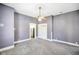 Spacious living room with a ceiling fan, neutral walls, and built in shelves at 93 Walnut St, Indianapolis, IN 46227