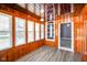 Well-lit sun room with wood panels and many windows, perfect for relaxing at 93 Walnut St, Indianapolis, IN 46227