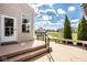 Scenic backyard with a view of the pond, a wooden bench, and well-maintained landscaping at 9559 Summer Hollow Dr, Fishers, IN 46037