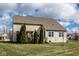 Expansive backyard featuring mature trees and a charming pergola covered deck, perfect for outdoor living at 9559 Summer Hollow Dr, Fishers, IN 46037