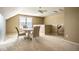 Cozy carpeted bonus room with stylish dining table and chairs, perfect for casual gatherings at 9559 Summer Hollow Dr, Fishers, IN 46037
