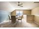 Bright bonus room offers a dining space with great natural light and neutral color palette at 9559 Summer Hollow Dr, Fishers, IN 46037