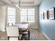 Chic dining room featuring a modern light fixture, neutral decor and a calming color palette at 9559 Summer Hollow Dr, Fishers, IN 46037