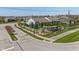 Stone community entrance featuring a white fence and professionally landscaped median at 9559 Summer Hollow Dr, Fishers, IN 46037