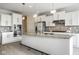 The kitchen features granite counters, stainless appliances, mosaic tile backsplash, and a large island with seating at 9559 Summer Hollow Dr, Fishers, IN 46037