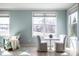 Bright living room featuring a sitting area, ample windows, and stylish furniture for a comfortable living space at 9559 Summer Hollow Dr, Fishers, IN 46037