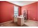 Bright home office features a modern desk and shelving unit, bathed in natural light from the window at 9559 Summer Hollow Dr, Fishers, IN 46037