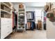 Well-organized walk-in closet with ample shelving, hanging rods, and storage baskets for optimal organization at 9559 Summer Hollow Dr, Fishers, IN 46037