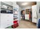 Walk-in closet featuring organized shelving, hanging racks, and drawers for optimal storage solutions at 9559 Summer Hollow Dr, Fishers, IN 46037
