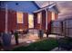 Cozy backyard with outdoor seating area, brick exterior, and string lights for evening enjoyment at 1014 Shannon Ave, Indianapolis, IN 46201