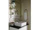 Bathroom sink and faucet, with decorative shelves, a mirror, and modern fixtures at 1014 Shannon Ave, Indianapolis, IN 46201