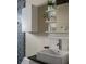 Bathroom vanity with modern sink, mirror, lighting, and storage shelves at 1014 Shannon Ave, Indianapolis, IN 46201