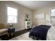 Bedroom featuring neutral color palette, natural light, modern decor, and dark hardwood floors at 1014 Shannon Ave, Indianapolis, IN 46201